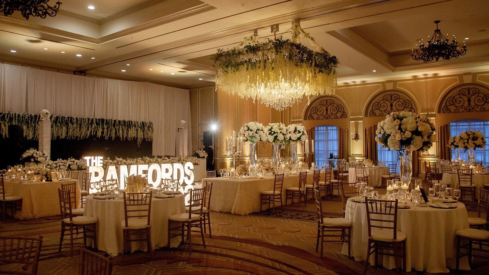 Wedding reception ballroom with ambient uplighting